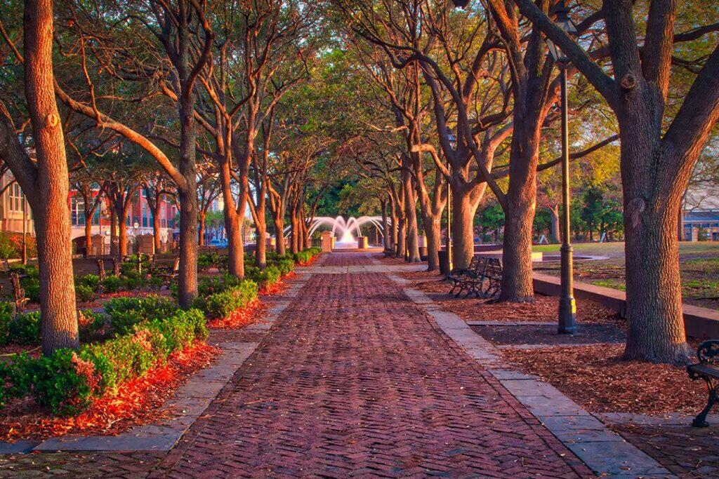 Walking through the trees to a fountain in Charleston
